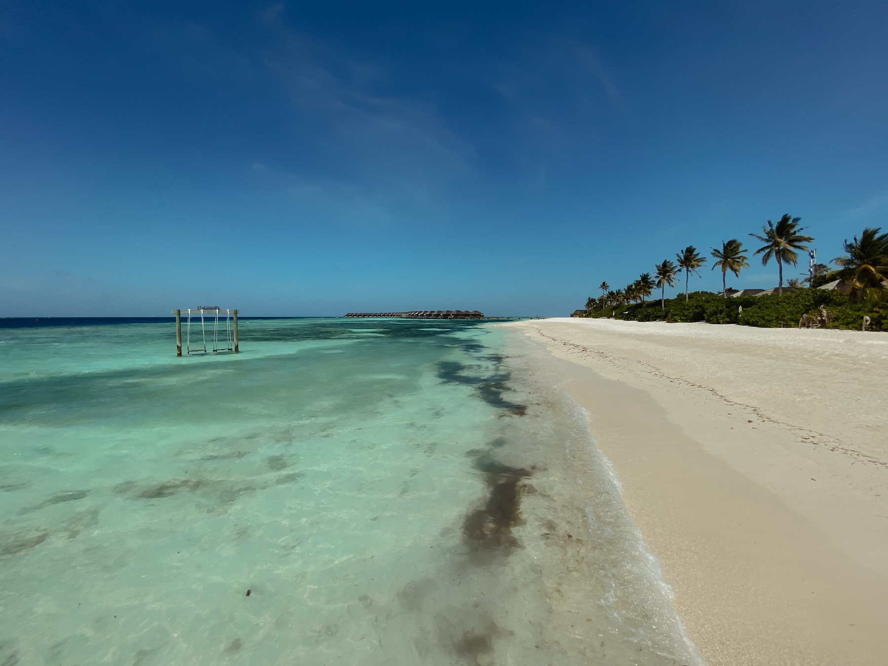 honeymoon advice hurawalhi island resort the maldives beach scene with swings over the ocean