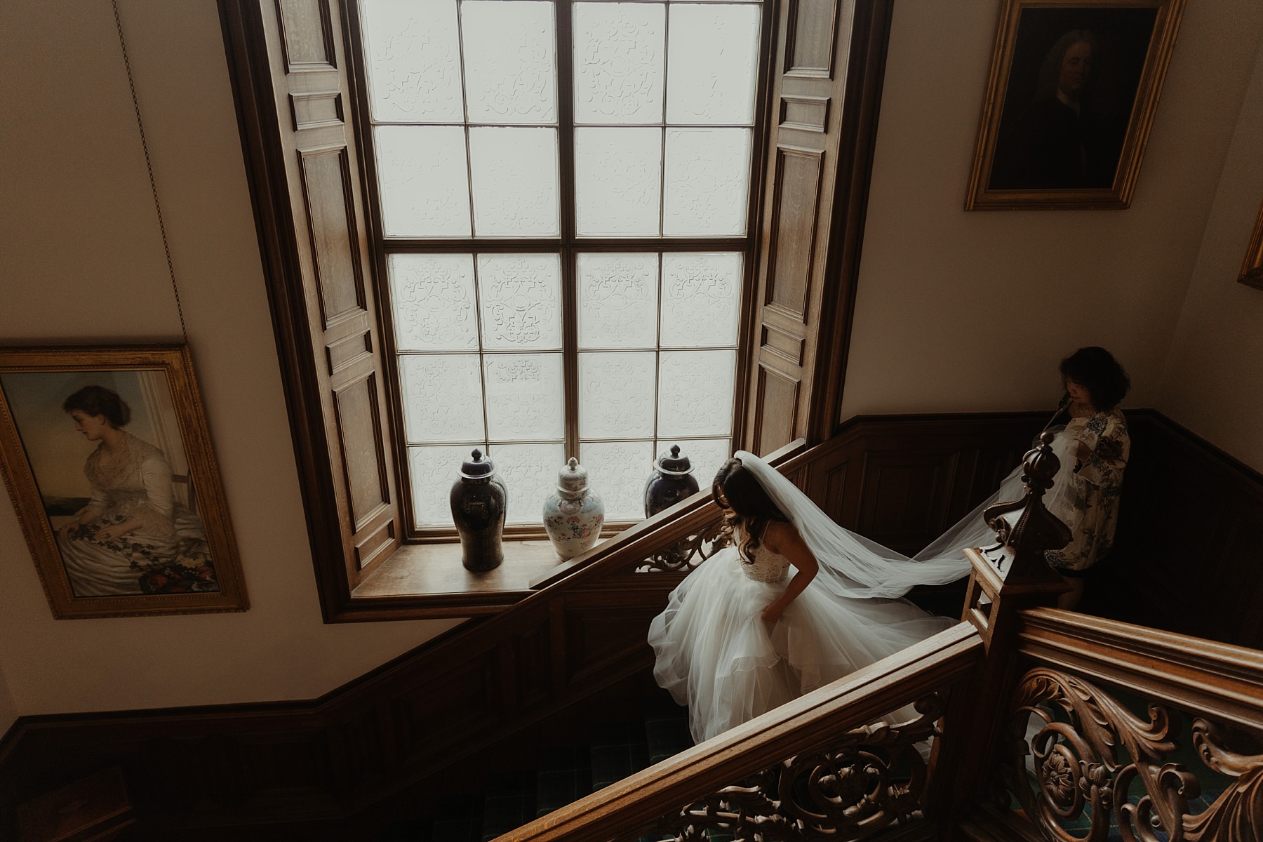 american bride walking down staircase in hayley paige wedding dress at cluny castle wedding scotland