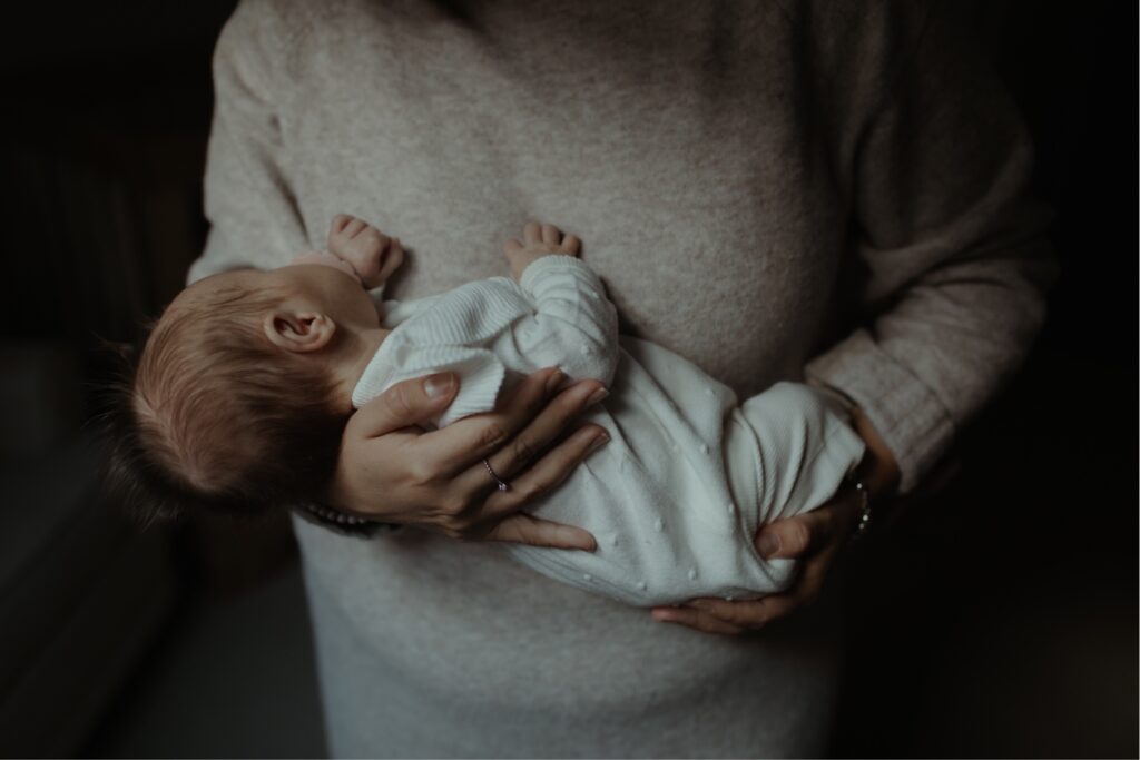newborn photos of mother holding baby by newborn photographer toronto ontario