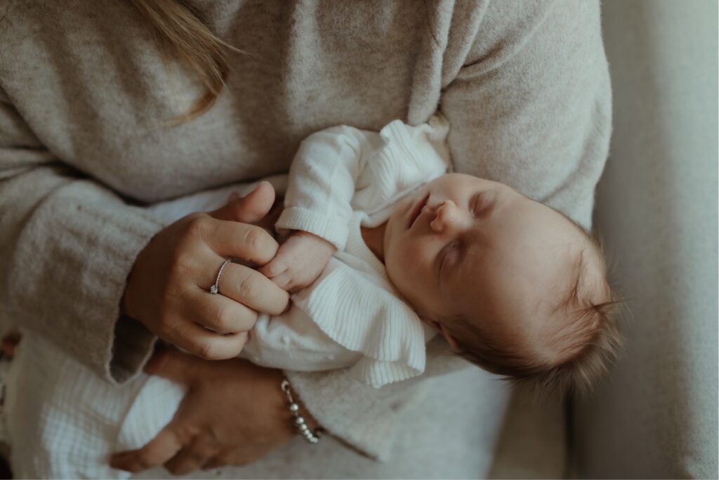 newborn photos of mother holding baby by newborn photographer toronto ontario