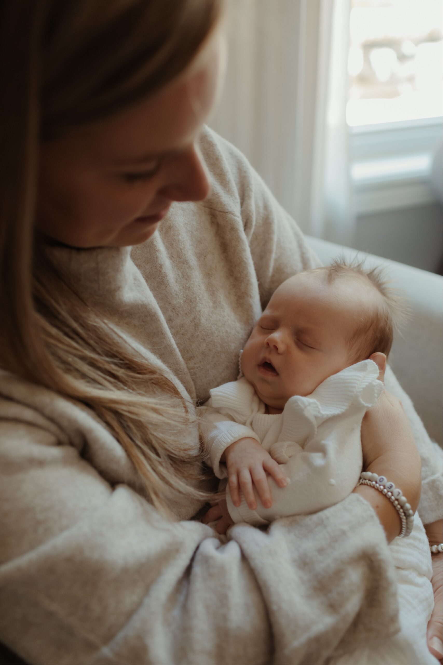 newborn photos of mother holding baby by newborn photographer toronto mississauga GTA